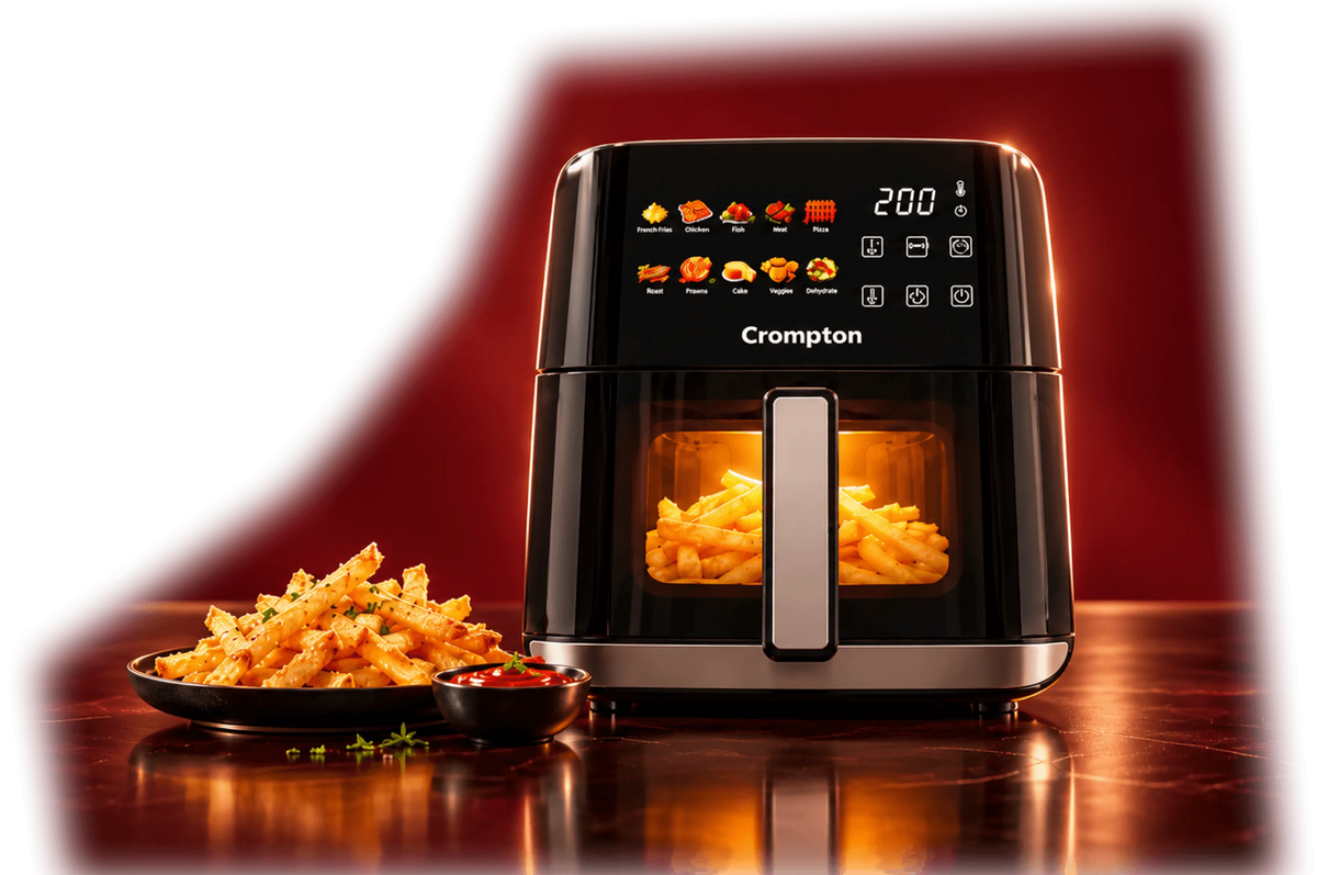 Crompton Ameo Edge air fryer on a table beside a plate of fries